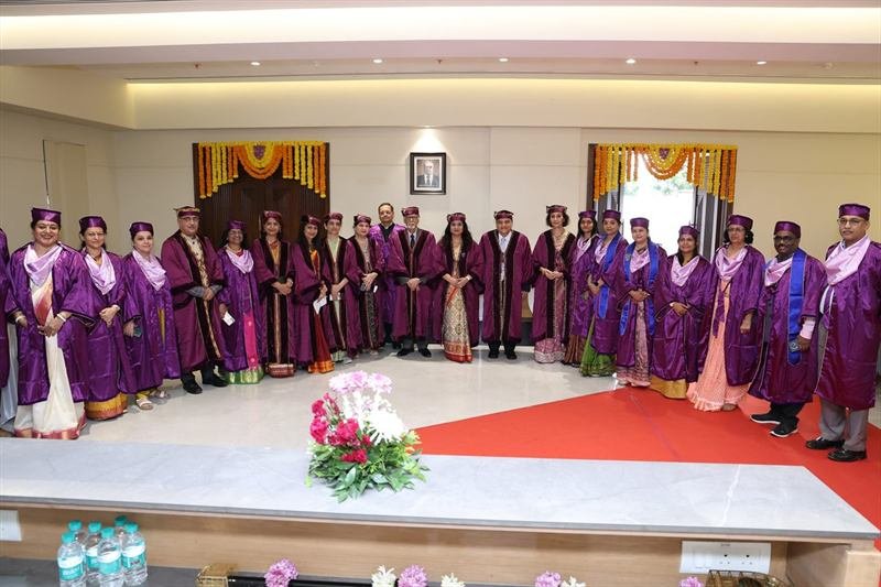 Faculty and dignitaries in convocation robes at HSNC University