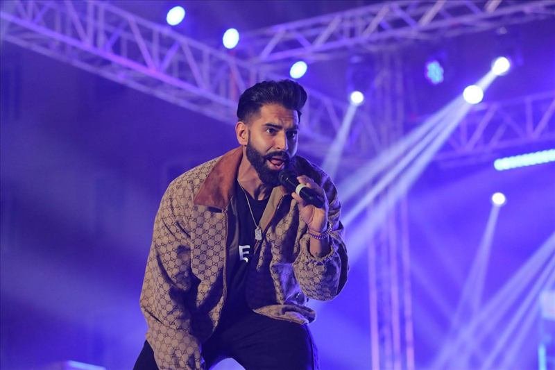 Parmish Verma performing on stage at KRMU
