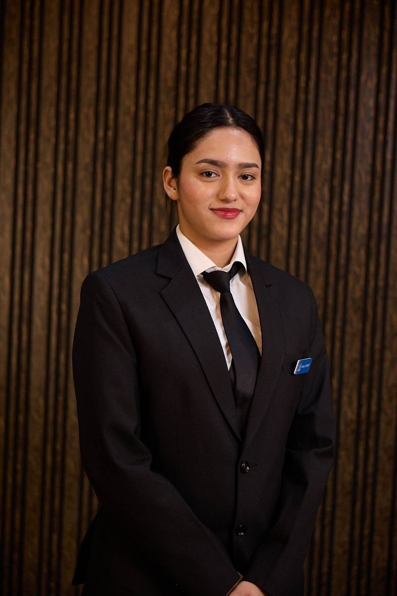 A KRMU student in formal business attire
